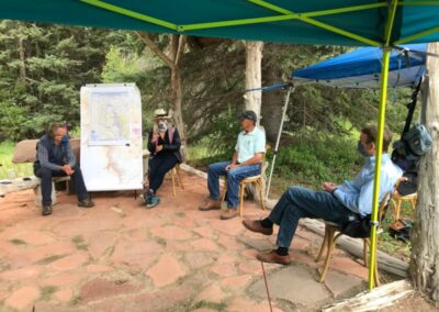 Senator Bennet with County Commissioners and other stakeholders.